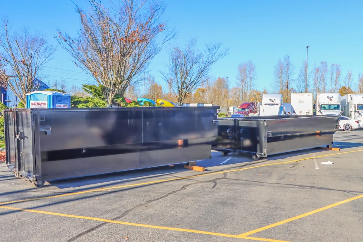 Professional dumpster rental service with roll-off container on residential driveway in Sarasota